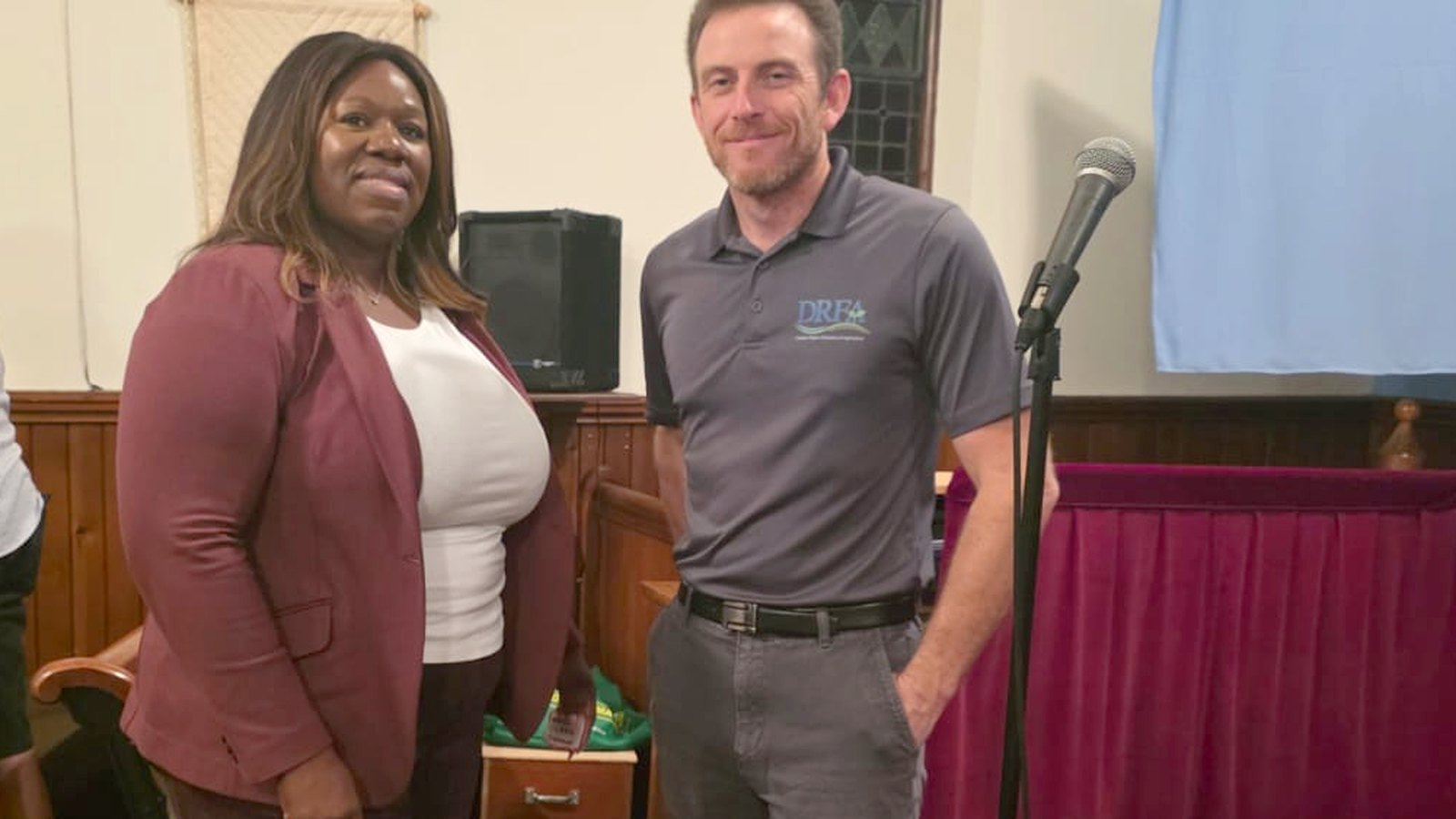 Nadea Clarke with a representative of the Durham Region Federation of Agriculture at a community event in Oshawa.